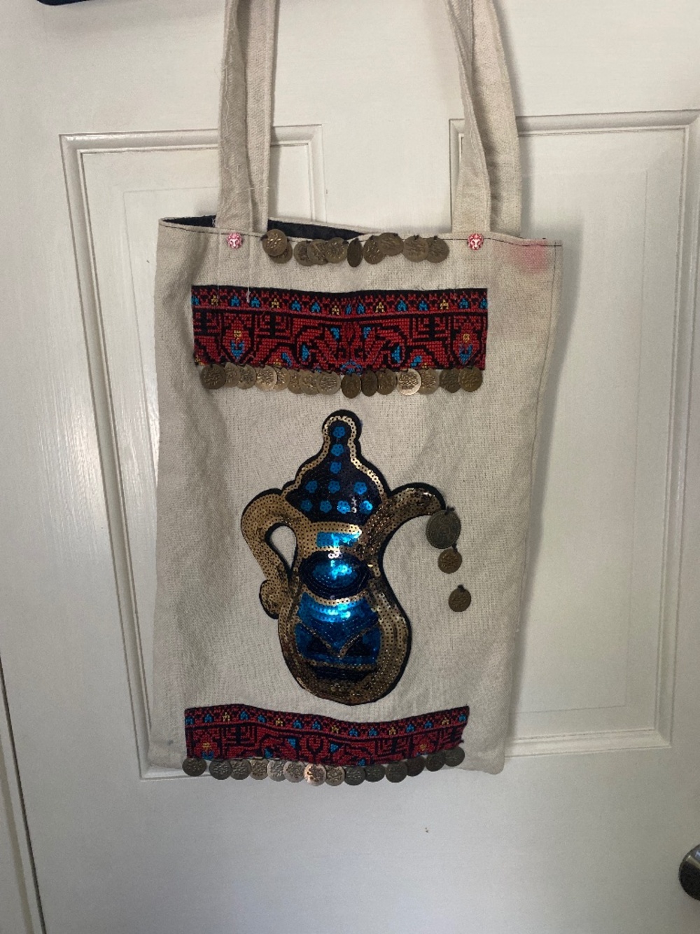 Funky textured bag. Has sequins burlap and coins Arabic coffe pot